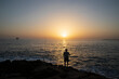 © Caner - wide angle of sunset and a fisherman fishing alone