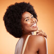 © K Abrahams/peopleimages.com - Skincare, cosmetics and black woman with smile, being happy, confident and brown studio background for body care or being bold for natural beauty. Makeup, female smooth skin or girl afro for wellness