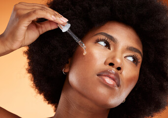 face serum, skincare and black woman using beauty oil product with pipette for skin. wellness, afro 