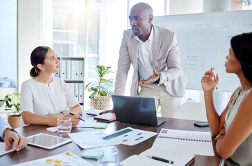 Poster - Business, black man and speaker, presentation leader and planning with business people in meeting. Diversity, laptop and paperwork, talking and listening to corporate pitch and project strategy.