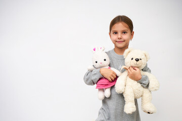 Wall Mural - Portrait of little girl with white toy bear