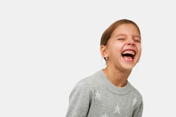Wall Mural - Cute little girl laughing on white background with copy space