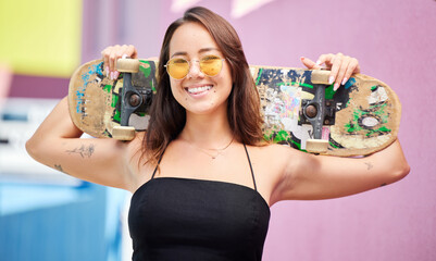 Skateboard, cool woman and gen z skater girl with trendy sunglasses outside for skate or skateboarding sport in city. Portrait of fashion female enjoy skating hobby, recreation and fun in Singapore