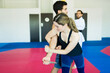 © AntonioDiaz - Strong woman practicing self-defense techniques