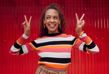 Poster - Peace sign, comic and black woman against red wall in the city of Amsterdam for holiday, travel and adventure. Thinking, fashion and young girl with crazy, and funny idea on vacation with smile