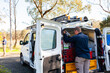 © Austockphoto - Male tradie and his work vehicle - electrician
