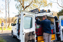 Male Tradie And His Work Vehicle - Electrician