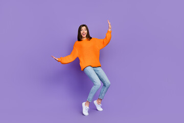 Wall Mural - Full length portrait of overjoyed cheerful person stand tip toe dancing good mood isolated on purple color background