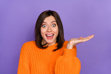 Sticker - Photo of impressed crazy girl open mouth arm hold empty space proposition isolated on violet color background