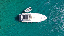 Aerial Drone Top View Photo Of Small Yacht - Boat Anchored In Tropical Exotic Paradise Bay With Emerald Open Ocean