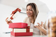 © ivanko80 - Woman looking at present box