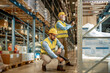 © ivanko80 - Warehouse workers scanning box