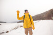 © Вероника Зеленина - The man dresssed yellow warm jacket and trousers, bagpack traveling in the snow landscape