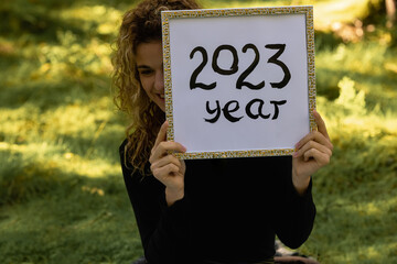 the year two thousand twenty-three HAPPY NEW YEAR 2024 - white paper plate with the inscription - 2023 year. Save paper. Stop deforestation. The year twenty twenty-three. 2023 year of environment