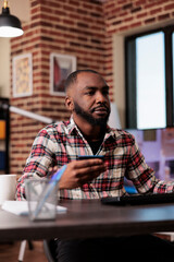 Poster - Male freelancer doing online shopping on computer, using credit card to make electronic payment transaction. Buying clothes on retail store website with discount purchase, working remotely from home.