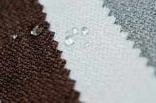 Close Up Water Drop On Gunny Textile. Bright Collection Of Gunny Textile Samples. Fabric Texture Background.
