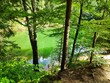 Green and blue lake, pond in Europe Poland with trees
