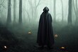 A terrible forest sorcerer with a canvas bag on his head and in a sackcloth robe stands in a dense forest with a black raven on his hand. Scarecrow. Halloween Tales. Horror, thriller.. High quality
