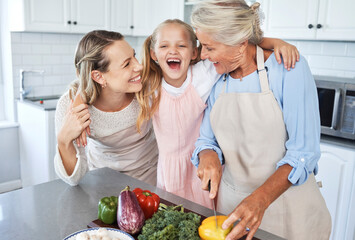 Wall Mural - Mother, grandma and child cooking as as happy family in a house kitchen with organic vegetables for dinner. Grandmother, mom and young girl laughing, bonding and helping with healthy vegan food diet