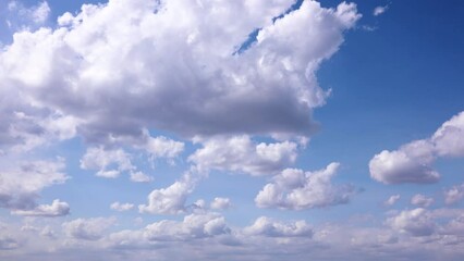 Wall Mural - Timelapse shooting white clouds moving fast in the blue sky