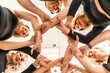 © svetograph - Team of people holding hands. Group of happy young women holding hands. Bottom view, low angle shot of human hands. Friendship and unity concept