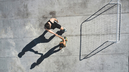 Poster - Soccer, sports and handshake with a man and woman athlete shaking hands after a game on a rooftop from above. Football, exercise and training with a male and female playing a match for health