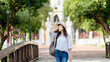 © Piches - Happy holiday.Lifestyle Image of carefree traveling smiling woman in white shirt and  hat relaxing her vacation time on bridge background.