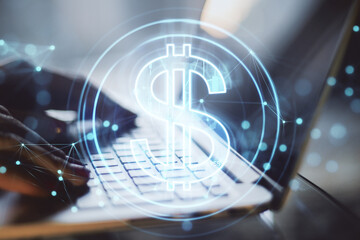 Aufkleber - Close up of hands using laptop computer with creative glowing dollar hologram on blurry backround. Futuristic hi-tech digital money and electronic economy of the future concept. Double exposure.