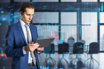Poster - Corporate business and global economy concept with handsome man using digital tablet on virtual screen background with financial chart and world map