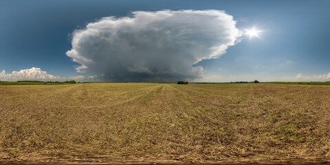 Wall Mural - full seamless 360 hdri panorama view among farming fields with storm cloud in overcast sky in equire