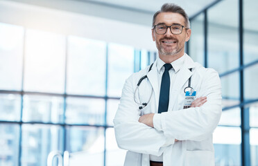 Poster - Doctor, man and happy with arms crossed in hospital for medical, career and happiness for portrait. Medic, smile and work in clinic for healthcare, wellness and health while working in Washington DC