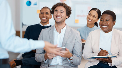 Business people, listening and smile for workshop training in marketing, sales and corporate strategy at the office. Diverse employee team in conference coaching and smiling for learning at workplace