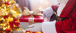 © candy1812 - View of hands of Santa Claus with giftbox in his hans indoors.