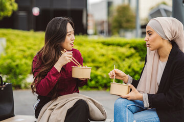 multiracial young co-workers women on the lunch break