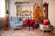Happy new year interior christmas. Red Decorated glowing tree, two armchair, fireplace with candles and gifts
