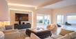 © Caia Image - Home showcase interior living room with ocean view and TV