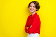 Side profile photo of satisfied gorgeous lovely woman with bob hairstyle wear red shirt hands folded isolated on yellow color background