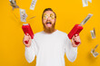 Photo of cool beard orange hair man shoot money gun wear dollar eyewear white shirt isolated on yellow color background