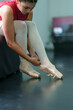 © ND STOCK - beautiful legs of a girl ballerina wearing pointe shoes  background  from above with copy space practicing ballet slim elegant feet of ballet dancers