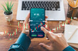 © Thapana_Studio - Businessmen work with stock market investments using smartphones to analyze trading data. smartphone with stock exchange graph on screen. Financial stock market.