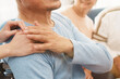 © jes2uphoto - Mature man in elderly care facility gets help from hospital personnel nurse. Senior man, aged wrinkled skin hands and caregiver supportive hand close up