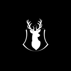 Poster - Deer head with antlers on shield icon isolated on dark background