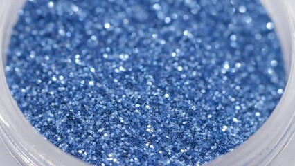Poster - blue sequins in a jar rotate in a circle