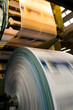 © Jose Luis Stephens - Close-up to the printed material coming out from a printing press machine