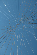 Broken Mirror Glass And Reflection Of Blue Sky  Background