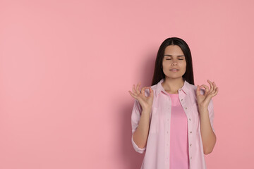 Sticker - Young woman meditating on pink background, space for text. Zen concept