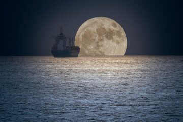 Wall Mural - commercial ship in a full moon night