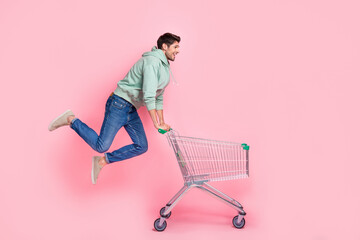Poster - Full length profile side photo of active stylish client look go empty space hurry market low price offer isolated on pink color background