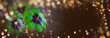 Leinwandbild Motiv New Year background banner with copy space - Lucky clover leaves with magical bokeh lights against beautiful brown background - clover, shamrock, good luck