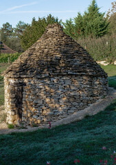 Wall Mural - close up of an aged, round, hand built stone shepherd's hut